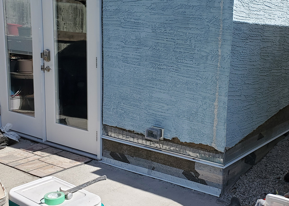 ECO-Max repairing the parging on a house in Calgary.